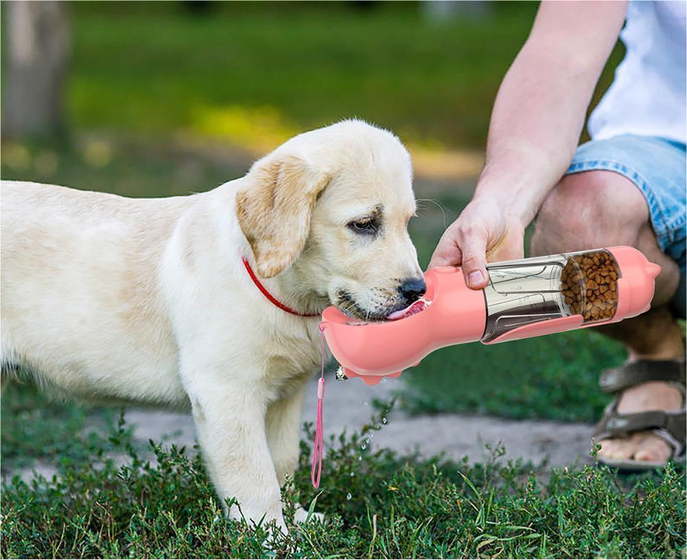 “Portable Pet Travel Water Bottle – Built-In Feeder Bowl & Poop Bag Storage”